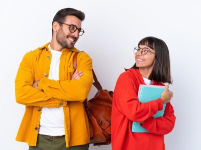young-student-couple-isolated-white-background-looking-shoulder-with-smile_1368-325081